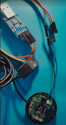 Module connected to a USB to UART converter with wires.