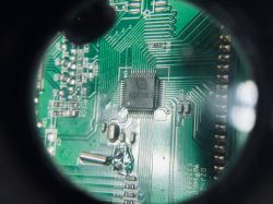 Close-up of a circuit board with a BCSF1508 chip and other electronic components.