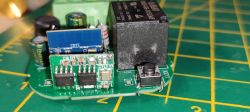 CB2S Module with Relay on Circuit Board CB2S module on a circuit board with a relay and a button.