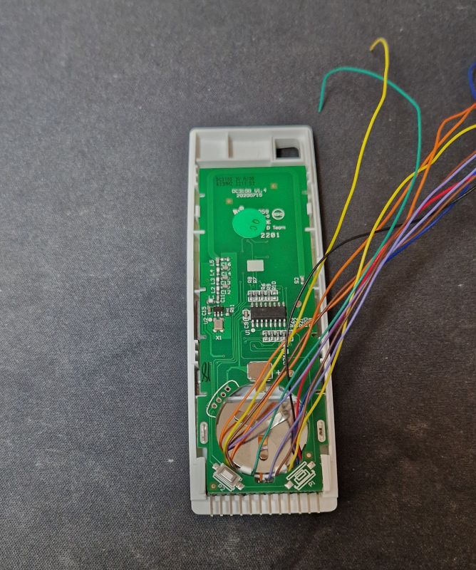 Blinds Remote Control with Attached Wires Remote control for blinds with the case opened and attached wires.