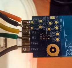 Close-up of a circuit board with connected colored wires.