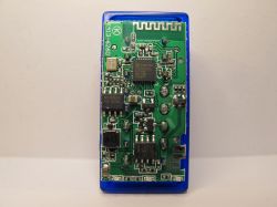 Close-up of an electronic circuit in a transparent blue plastic enclosure.