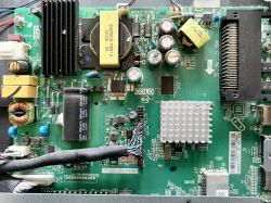 TV motherboard with visible electronic components.