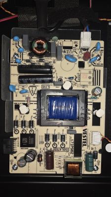 Close-up of a power supply PCB with transformer, coils and capacitors; “VESTEL 17IPS62” printed on board.