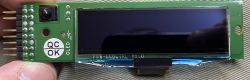 Wyświetlacz LCD OLED z napisem QC OK i oznaczeniem FLB-LCDCTRL V1.0.