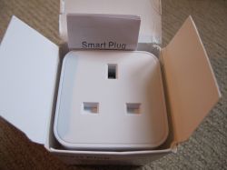 Tuya Smart Plug in Packaging Open box containing a Tuya smart plug, with the plug inside.