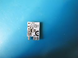 Small Printed Circuit Board Small printed circuit board on a blue background.
