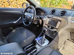 Ford car interior showing dashboard, steering wheel, and center console.