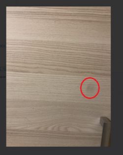 Widoczna plamka na jasnym tle po wymianie aparatu w iPhone X