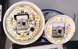 LED Modules with Electronic Components Two circular LED modules with visible yellow diodes and electronic components.