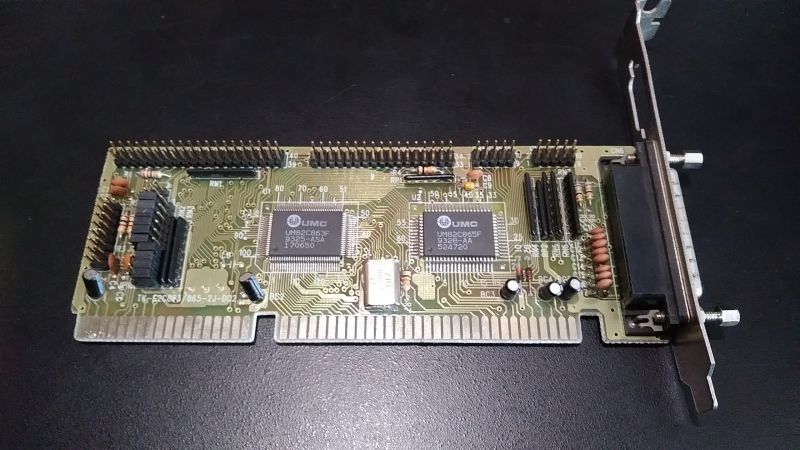 Vintage ISA I/O expansion card with UMC chips and a DB25 connector on the bracket
