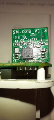Close-up of a circuit board with markings and a chip.