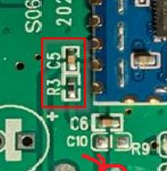 Circuit Board with Highlighted Components Close-up of a circuit board with a highlighted section showing electronic components.