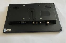 Rear of a small monitor with speaker grilles and ports: VGA, HDMI, RCA, USB, and BNC