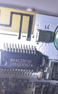 Close-up of a circuit board with microcontroller and 16.00 MHz crystal oscillator