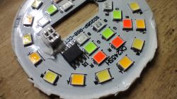 Printed circuit board with colorful LEDs and an integrated circuit.