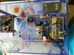 DIY molecular hydrogen generator enclosed in a clear plexiglass case.