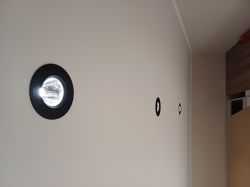 Three LED bulbs integrated into the ceiling, emitting dim light.