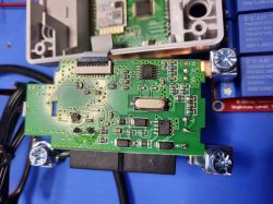 Open KWS-302WF Power Meter with Visible Electronic Circuits The image shows an open KWS-302WF power meter with a visible circuit board and electronic components.