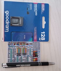 Goodram 128 GB microSD card with adapter, connection schematic card, and black pen.