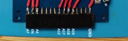 Close-up of an electronic connector with labeled pins.