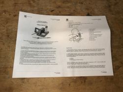 User manual for the YIHUA 926LED II soldering station on a wooden surface.