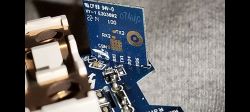 Close-up of a PCB with connector pin labels and indicators.