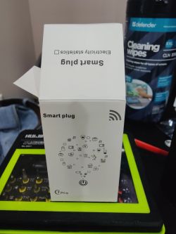 Smart plug box standing on a table.