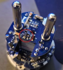 Close-up of a circuit board with a marked component.