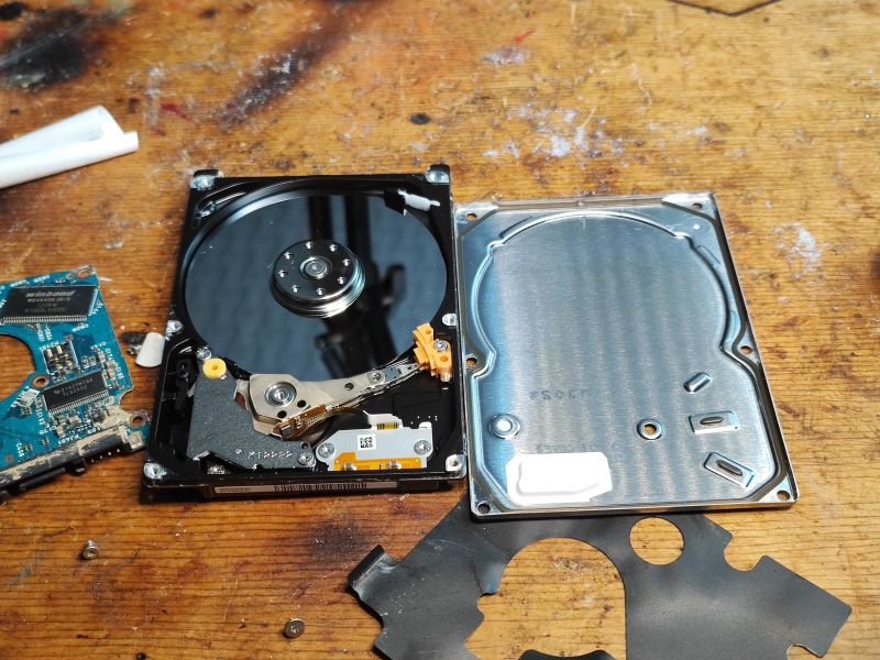 Inside a Seagate Hard Drive Inside of an open Seagate hard drive with visible platters and read/write head.