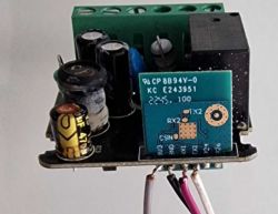 Close-up view of the SHUNSHUN WiFi mini switch with electronic components on the circuit board.