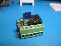 SparkleIoT Matter Mini Smart Switch Module SparkleIoT Matter Mini Smart Switch module on a blue background.