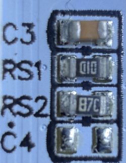 Close-up of handwritten resistor values and equations on a white background.