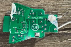Printed circuit board with test pad markings and inscriptions.