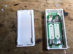 Interior of Sonoff DW2-Wi-Fi Door Sensor Interior of an opened Sonoff door sensor showing the PCB and battery compartment.