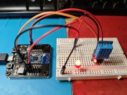 WiFi Module with DHT11 Sensor on Breadboard Development board with WiFi module and DHT11 sensor on a breadboard