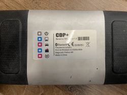 Stary skaner diagnostyczny Autocom CDP+ z naklejką informacyjną.