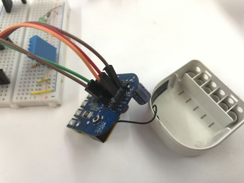 Refoss R10 module with UART wires connected for firmware flashing