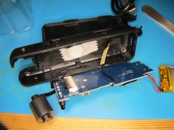 Interior of a disassembled electronic device Disassembled electronic device with PCB and lithium polymer battery