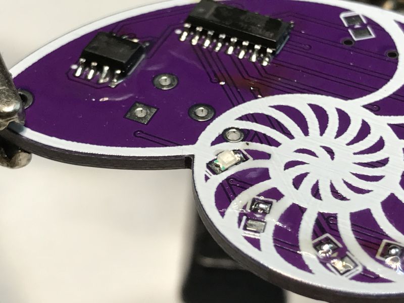 Printed Circuit Board with SMD Components Printed circuit board with SMD components and spiral pattern.
