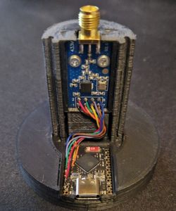 Close-up of DIY RF remote with ESP32-S3 and CC1101 module in black 3D-printed case