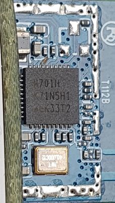 Electronic Module with W701H Chip Close-up of an electronic module with a chip labeled W701H - K71N5H1 - GK33T2 on a blue printed circuit board.