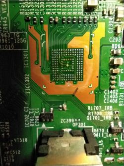 Close-up of a motherboard with visible traces and components.