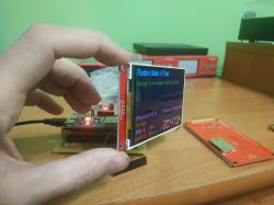 Color LCD with internet radio interface held in hand