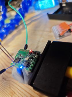 Circuit Board with LEDs and Probes Circuit board with attached probes and glowing LEDs.