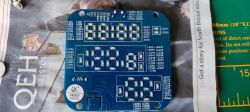 Electronic circuit board with a series of LEDs marked with a QC label