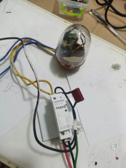 Electric contactor with connected wires on a workbench.