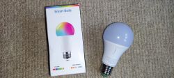 Smart Bulb with Packaging Smart Bulb and its packaging on a carpet.