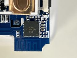 Close-up of a circuit board with an integrated circuit labeled T34.