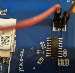 Close-up of a printed circuit board labeled TW2-0083A with connected wires.